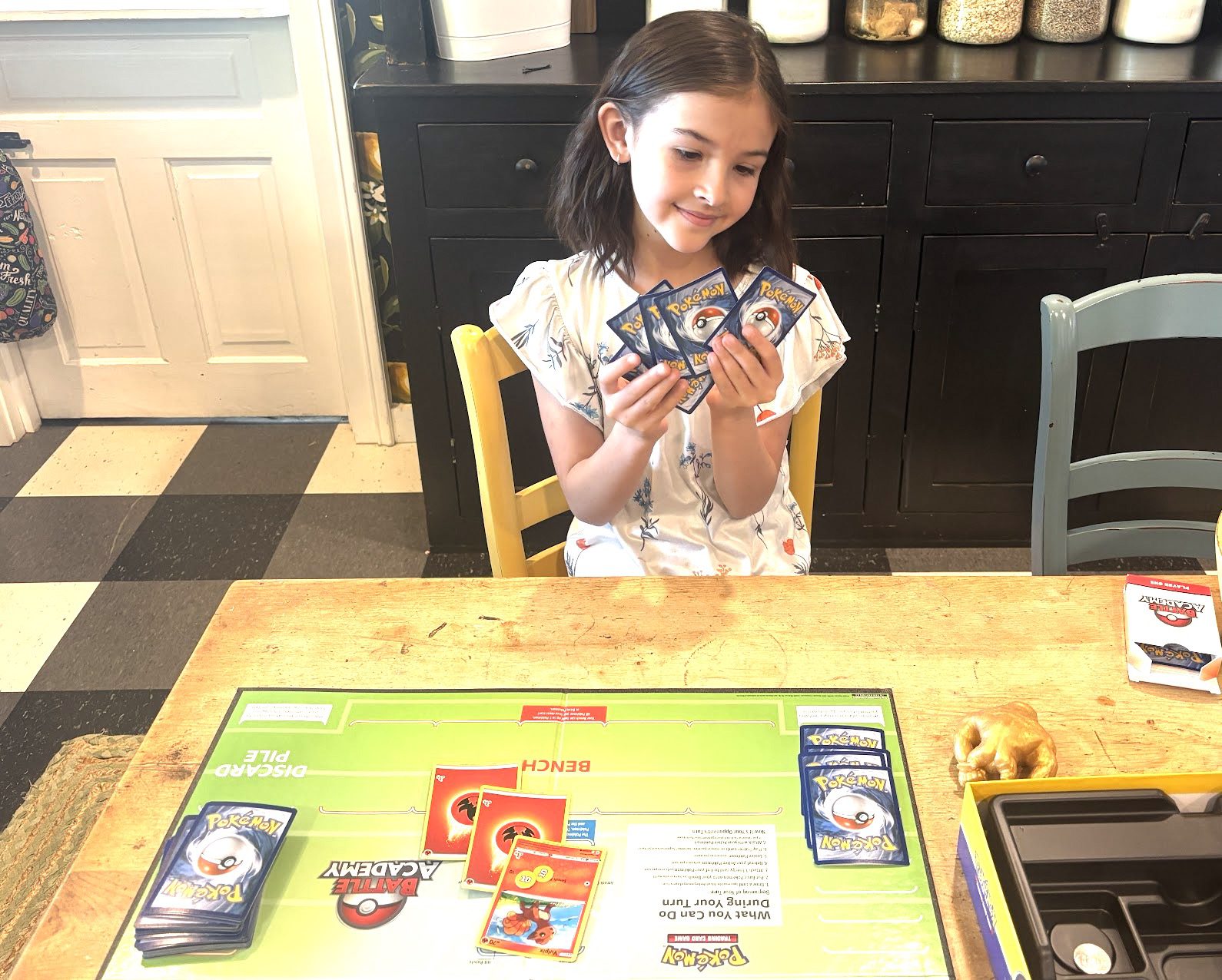 Young Pokémon player at The Fates Comics — family-run card shop in Scottsville Virginia